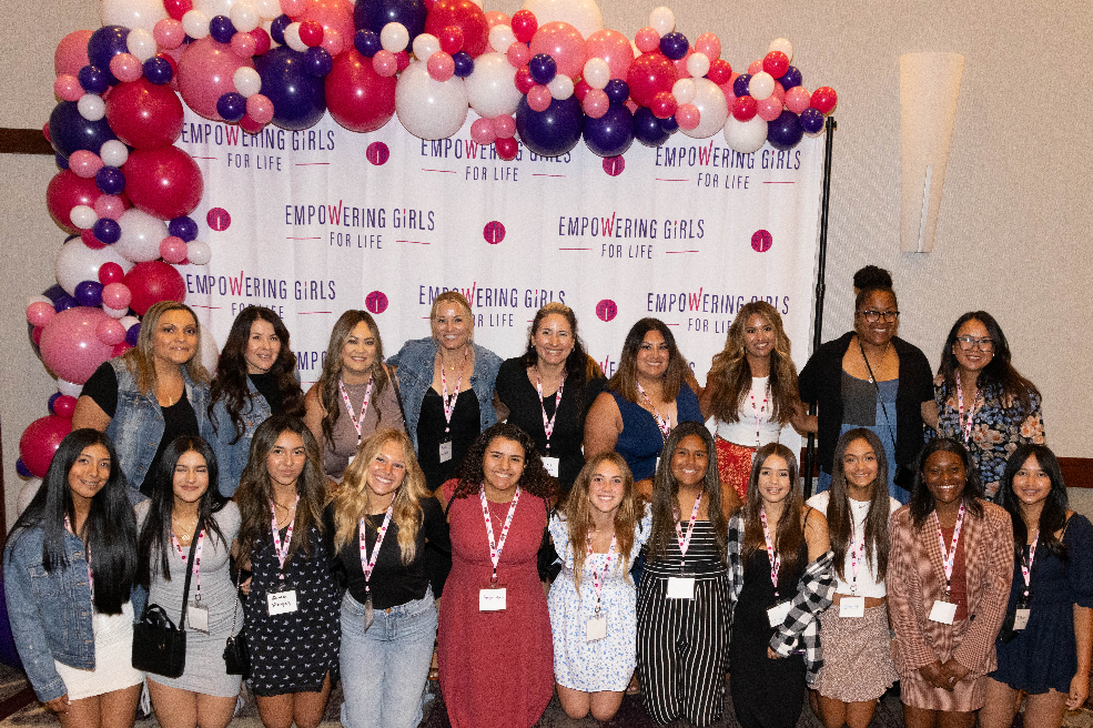 EGFL attendees in front of step and repeat banner_2023